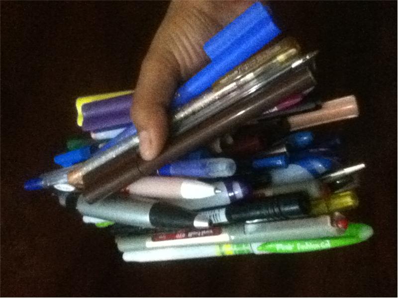 Most Pens Held In One Hand At Once